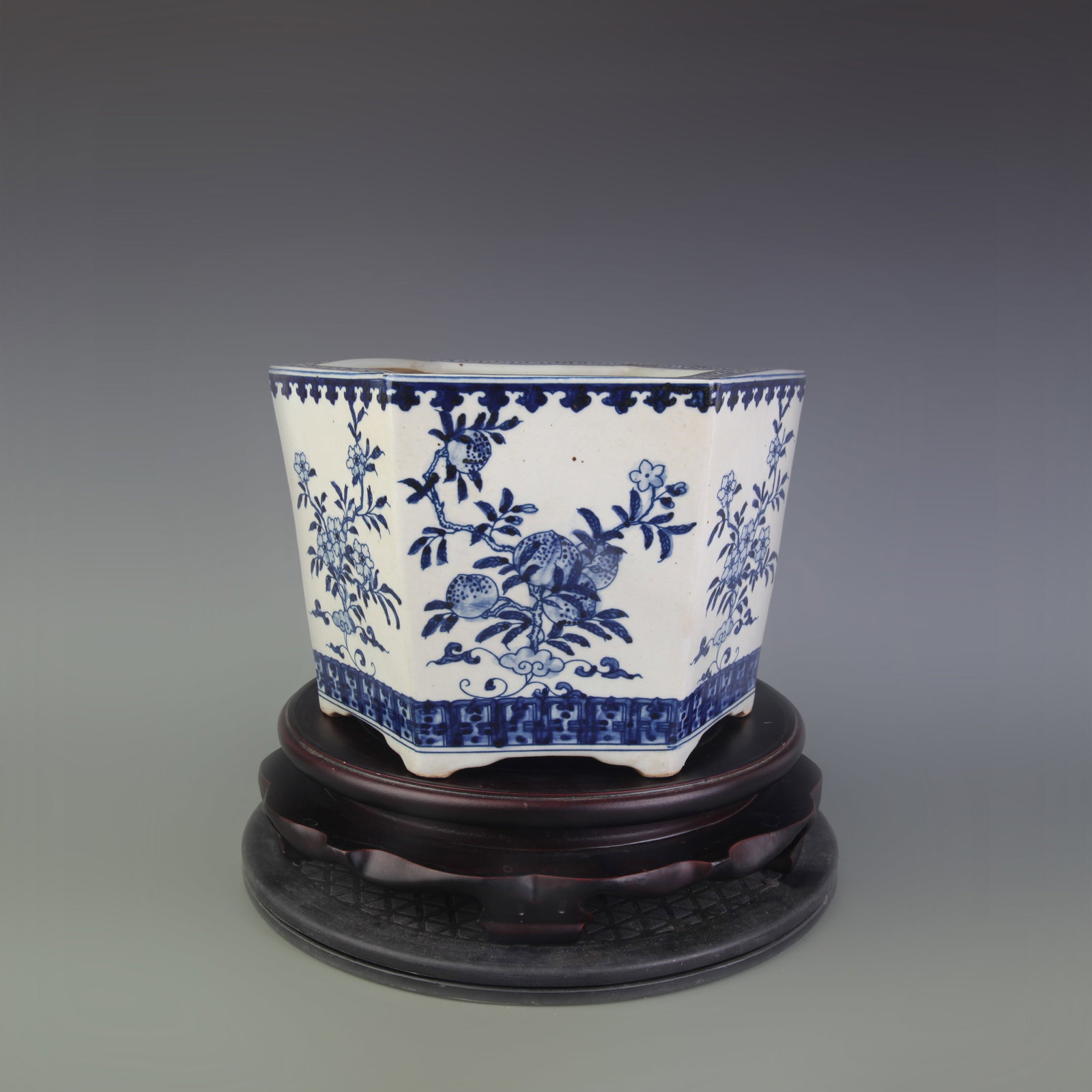 BLUE AND WHITE HEXAGONAL FLOWERPOT WITH FLORAL PATTERNS: Qing Dynasty; Width: 10.2 inch High: 0.8 inch; wooden base for picture and display purpose only.