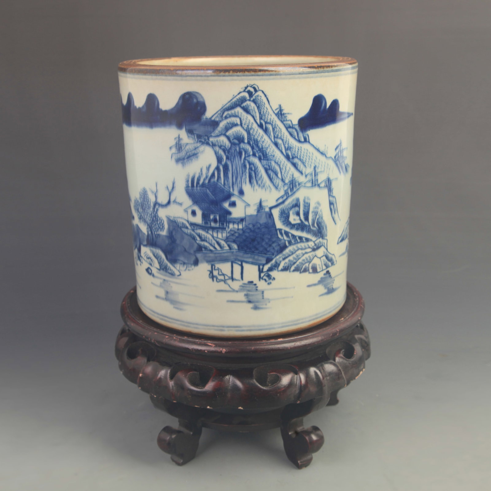 A BLUE-AND-WHITE BRUSH POT WITH LANDSCAPE AND FIGURAL DECORATION: Qing Dynasty Kang Xi Period; High: 8.50 inch;Diameter: 8.00 inch; wooden base for picture and display purpose only.