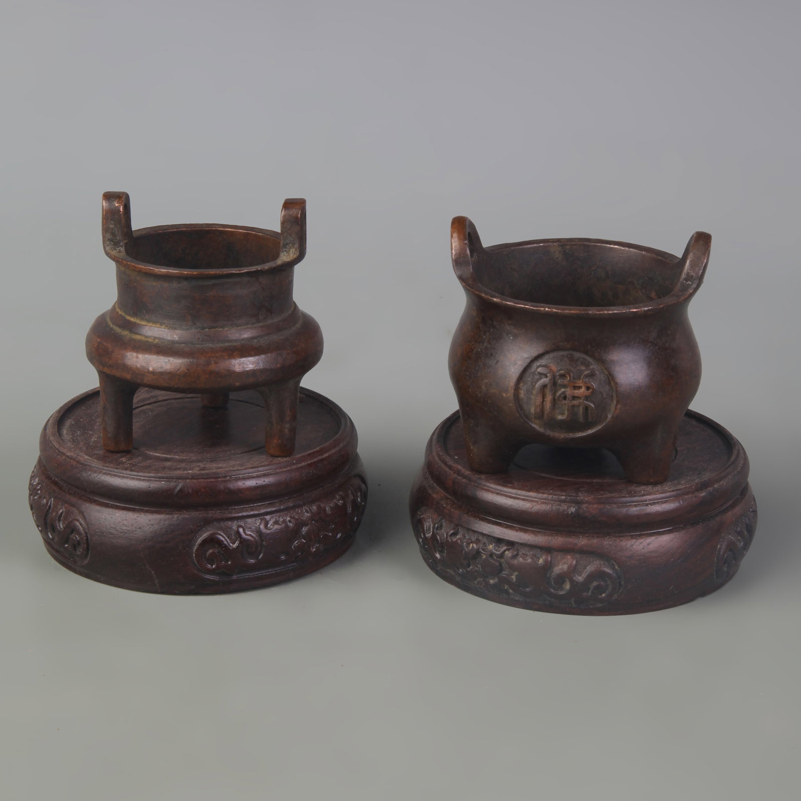 SET OF TWO SMALL BRONZE INCENSE BURNERS: Qing Dynasty, High:1.8 inch to 2.1 inch; wooden base for picture and display purpose only.