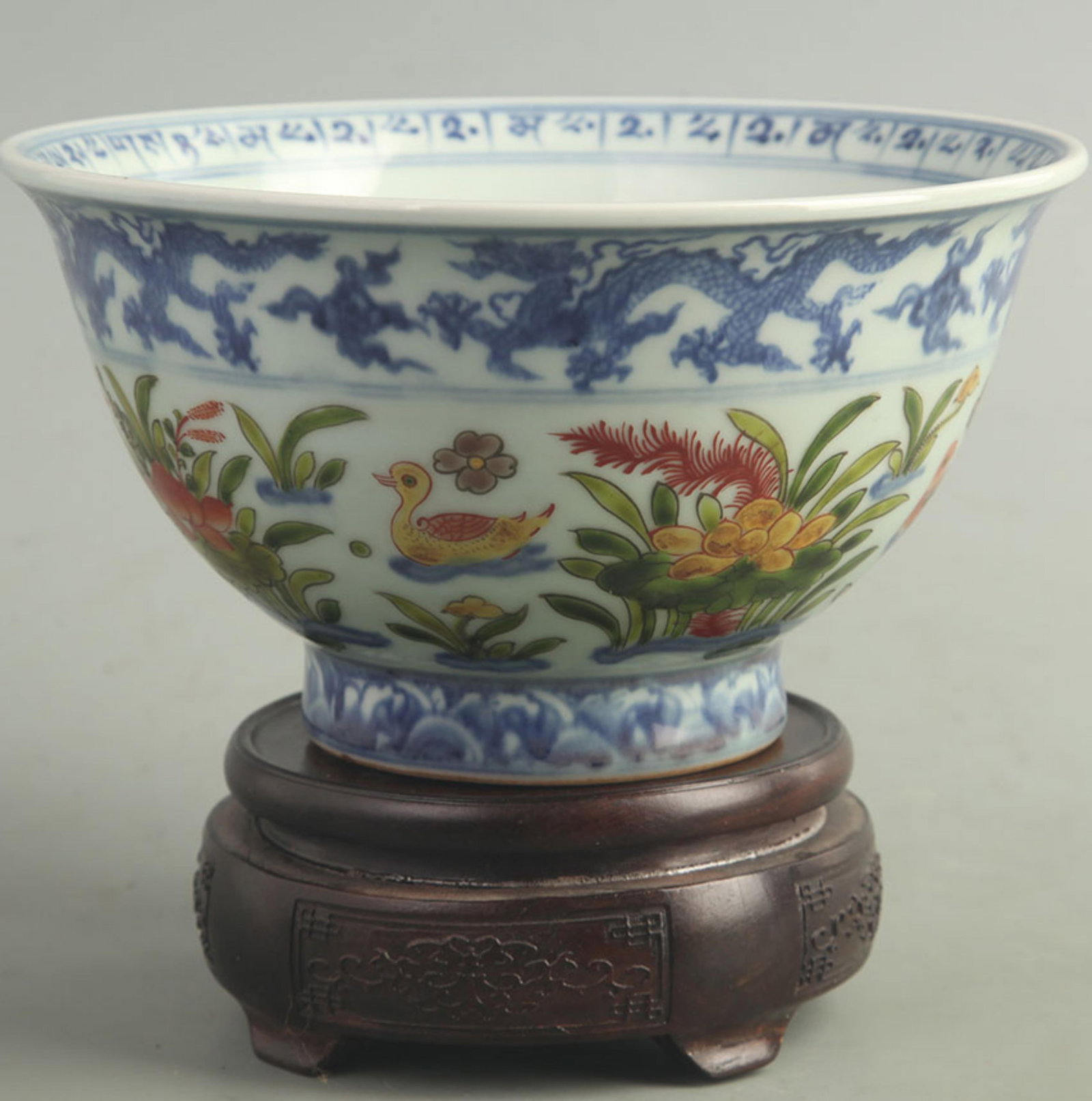 WUCAI FLORAL AND MANDARIN DUCK BOWL: Ming Dynasty Xuan De Period; High: 4.00 inch; Diameter: 7.30inck; wooden base for picture and display purpose only.