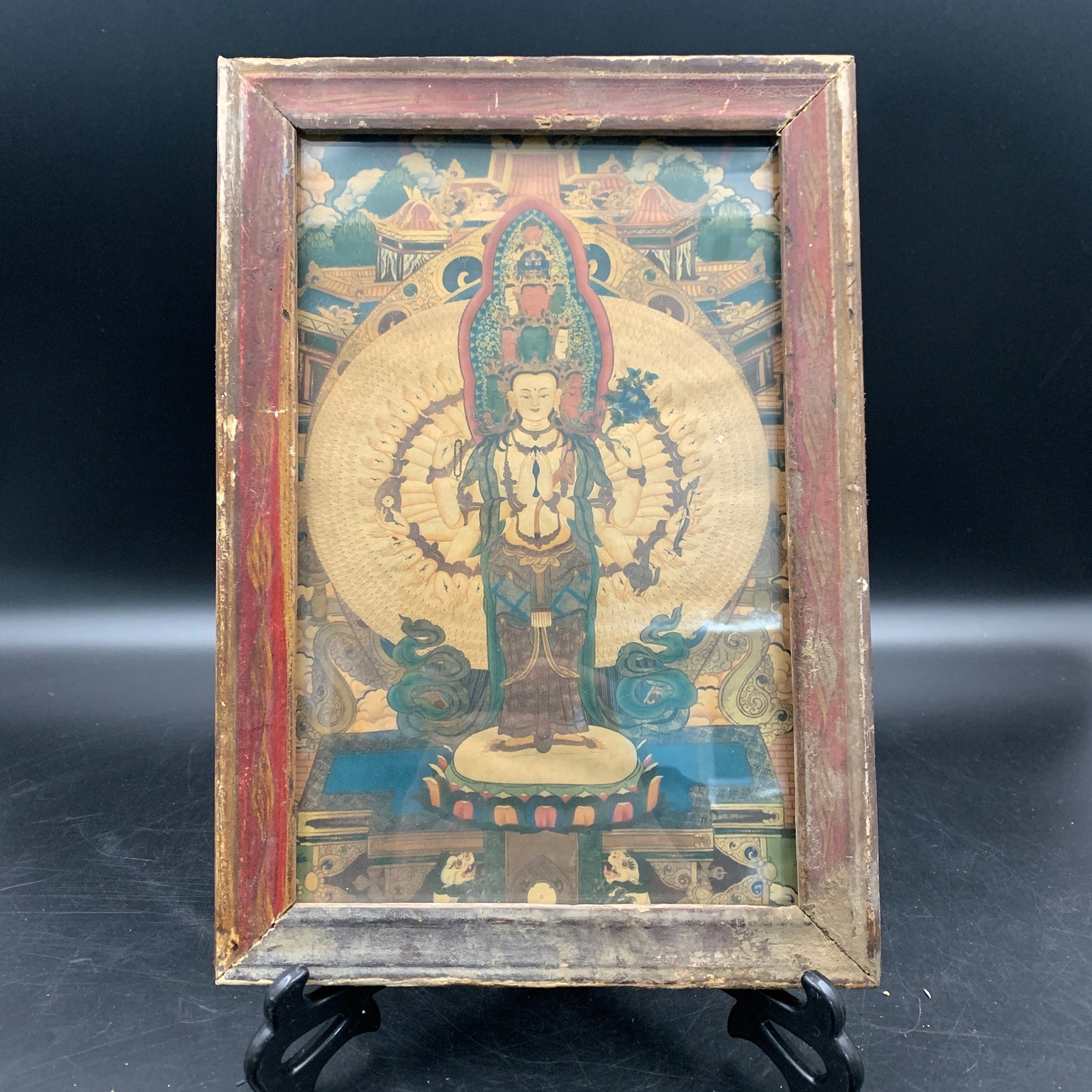 A WOOD FRAME ELEVEN-HEADED AVALOKITESHVARA PAINTING: Modern; Long: 11.6 inch; Width: 8.1 inch; High: 0.6 inch; wooden base for picture and display purpose only.