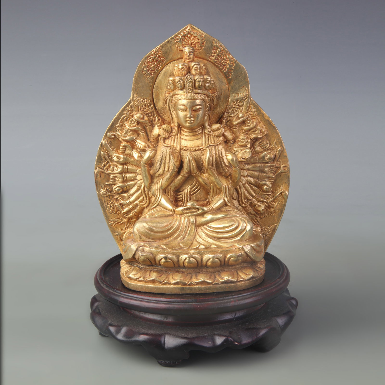 A FINE BRONZE THOUSAND-ARMED GUANYIN STATUE: Qing Dynasty; High:5.9 inch; wooden base for picture and display purpose only.
