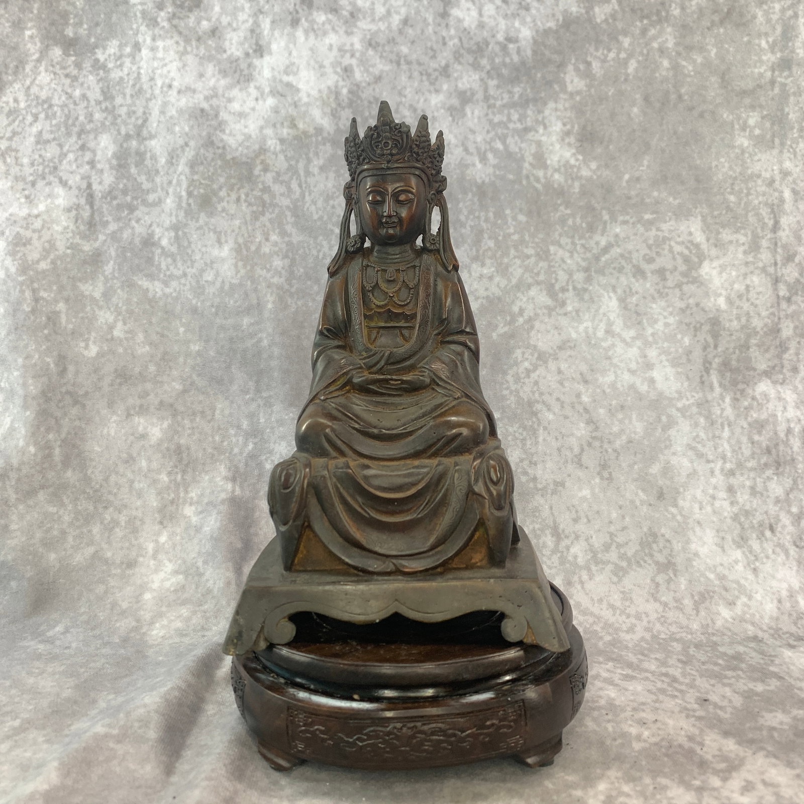 A FINE BRONZE SEATED CROWNED BUDDHA: 20th Century; Long: 5.5 inch; Width:4.4 inch; High: 9.5 inch; wooden base for picture and display purpose only.