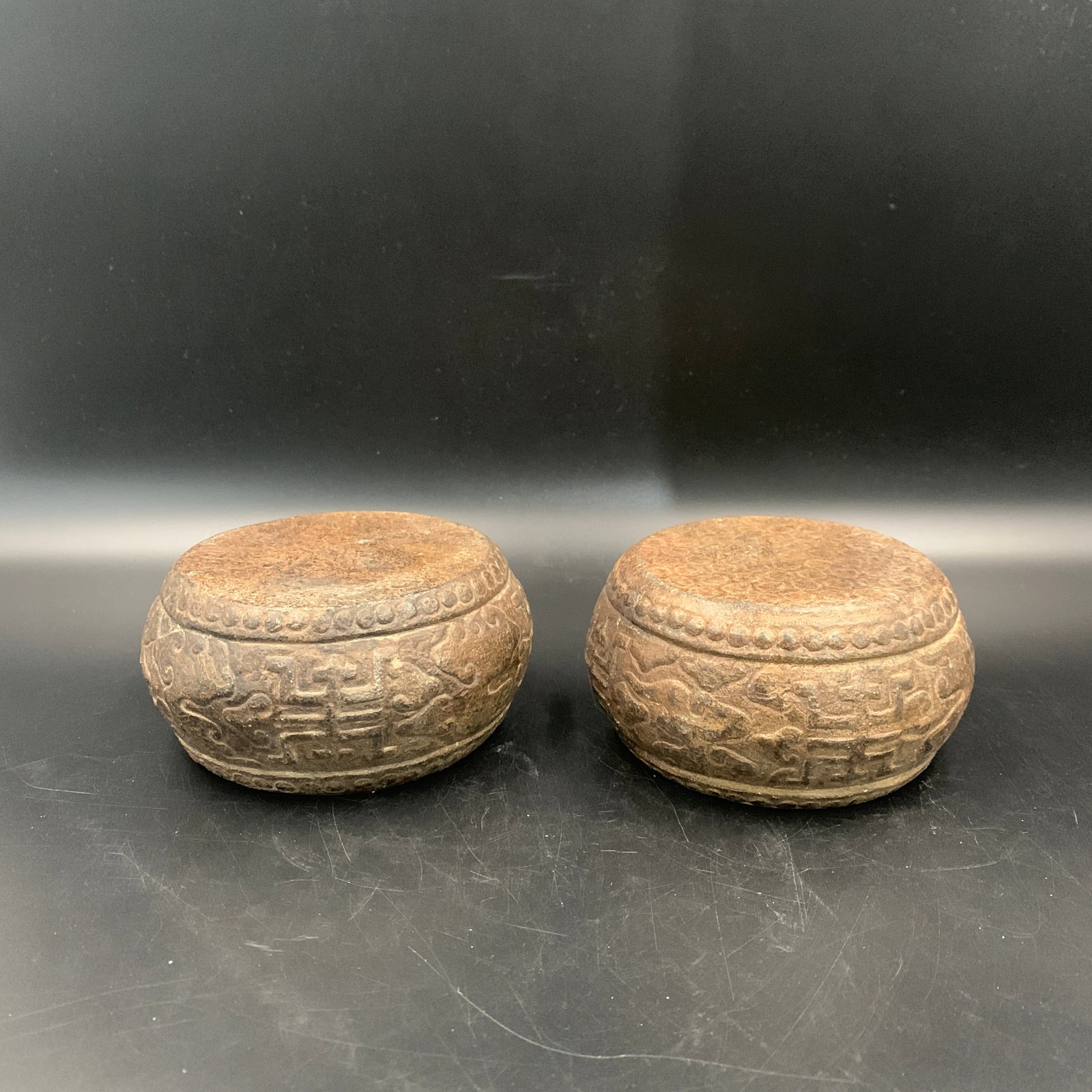 PAIR OF CARVED STONE CLOUD-SCROLL PATTERN BASES - 2