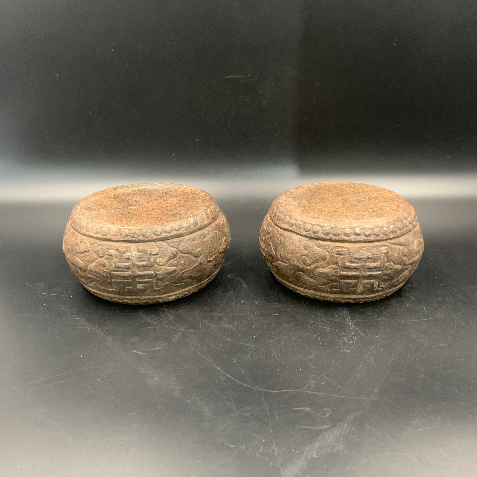 PAIR OF CARVED STONE CLOUD-SCROLL PATTERN BASES - 4