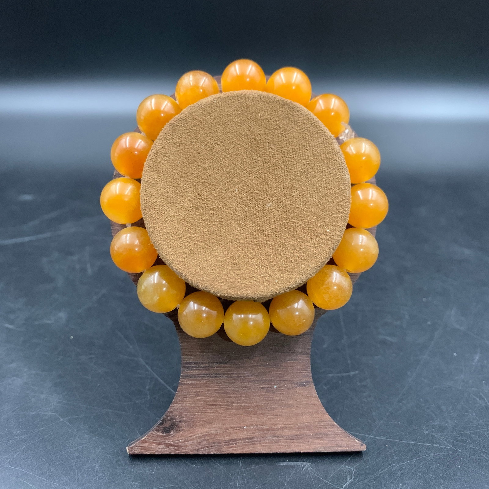 A FINE JADE MADE BRACELET: Modern; Long: 3.7 inch; Diameter: 0.46 inch; wooden base for picture and display purpose only.