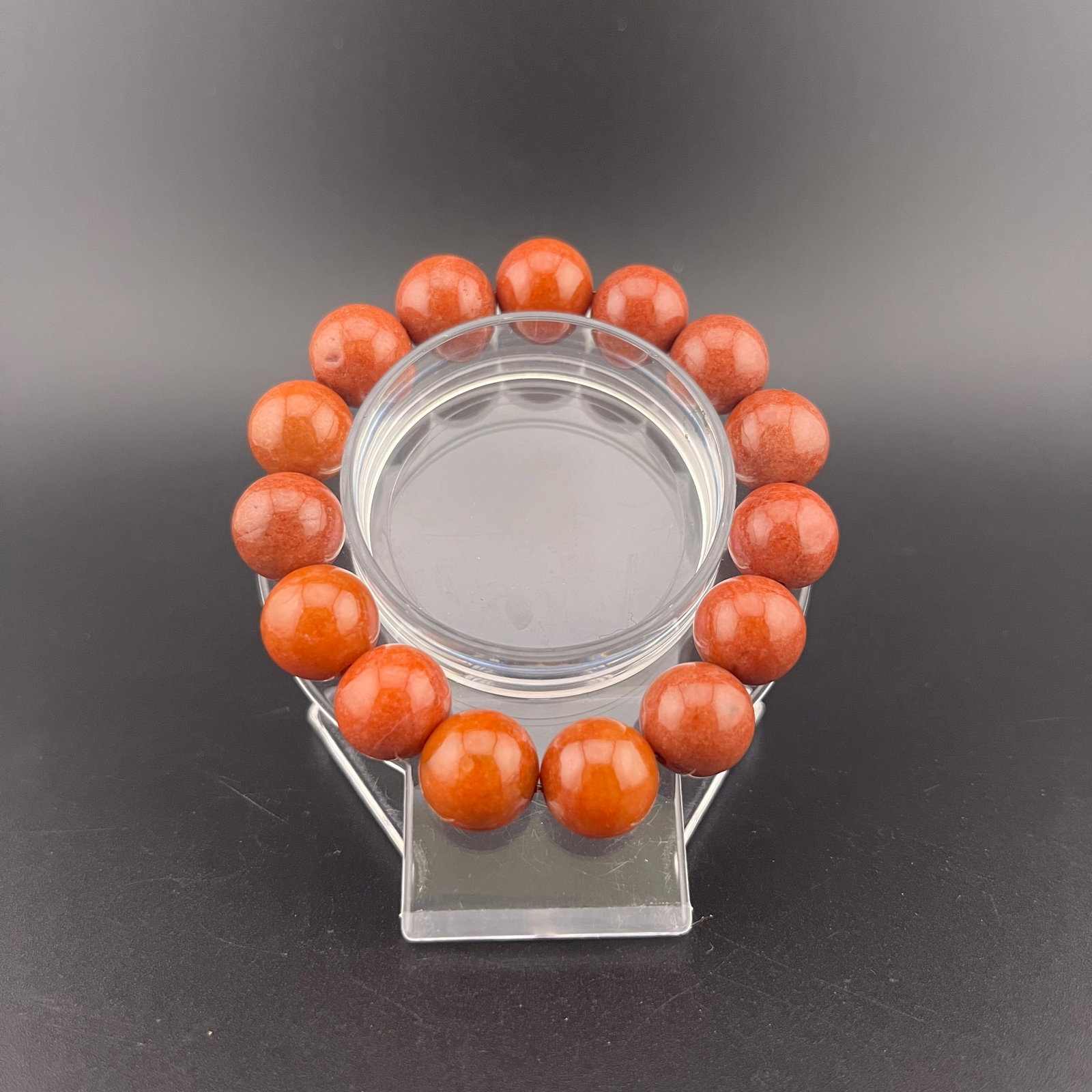A FINE JADE MADE BRACELET: Modern; Long: 3.4 inch; Diameter: 0.5 inch; wooden base for picture and display purpose only.