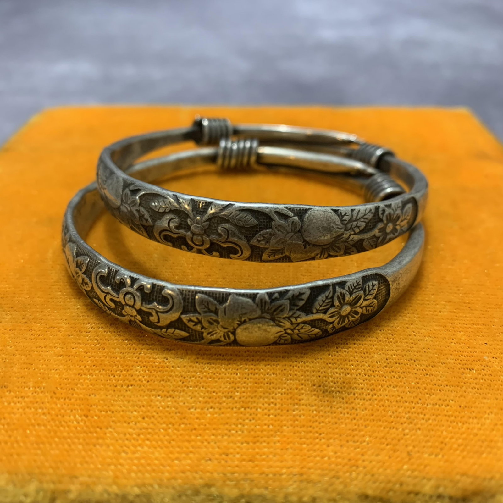 A PAIR OF WHITE BRONZE BANGLES: Republic Period; Diameter: 2.6 inch;; wooden base for picture and display purpose only.