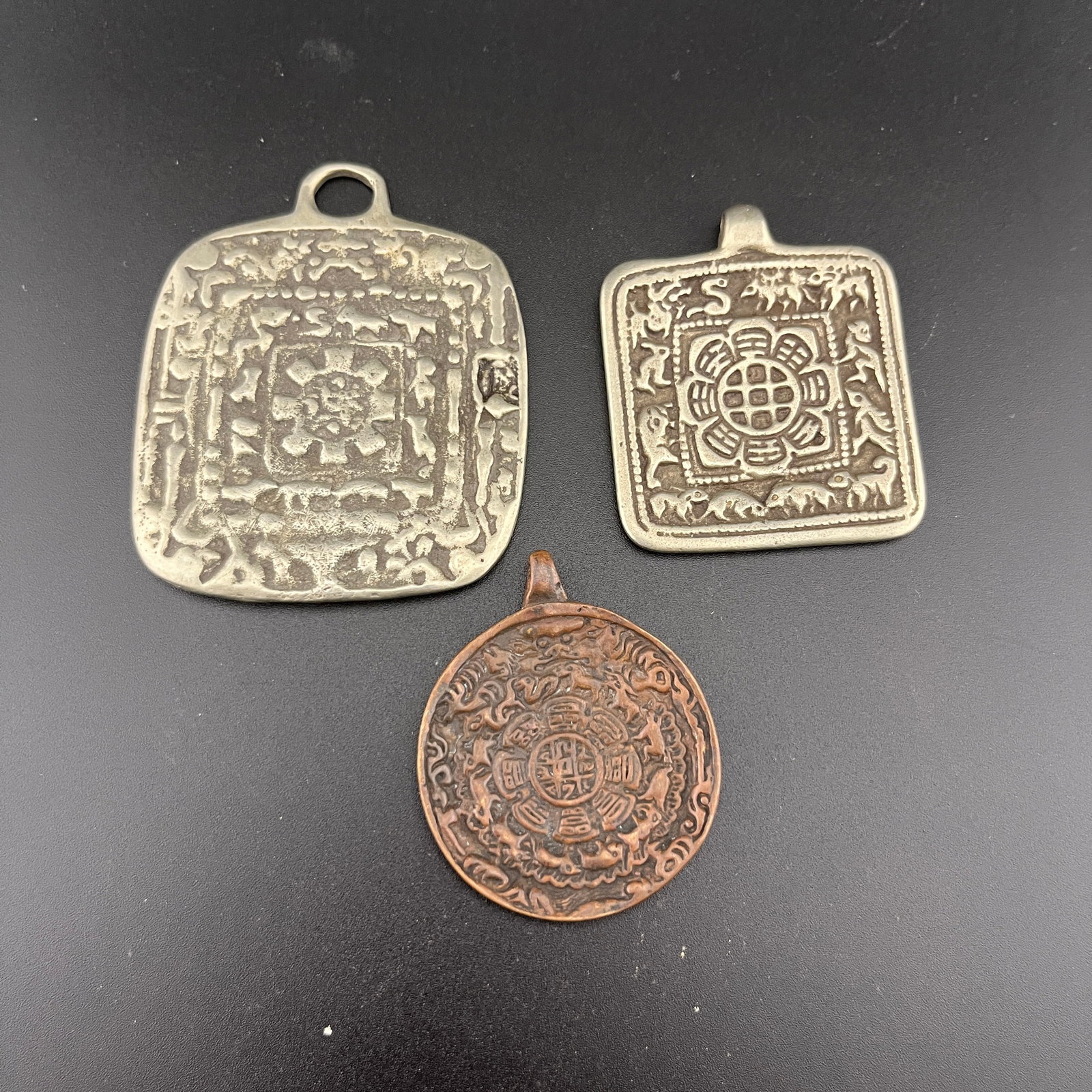 GROUP OF THREE TIBETAN NINE PALACE BAGUA SIPAHO PENDANT: 20th Century; Long: 2.52 inch; Width:2.1 inch; High: 0.12 inch; Long: 1.98 inch; Width:1.68 inch; High: 0.18 inch; Long: 1.83 inch; Width:1.5 inch; High: 0.13 inch;