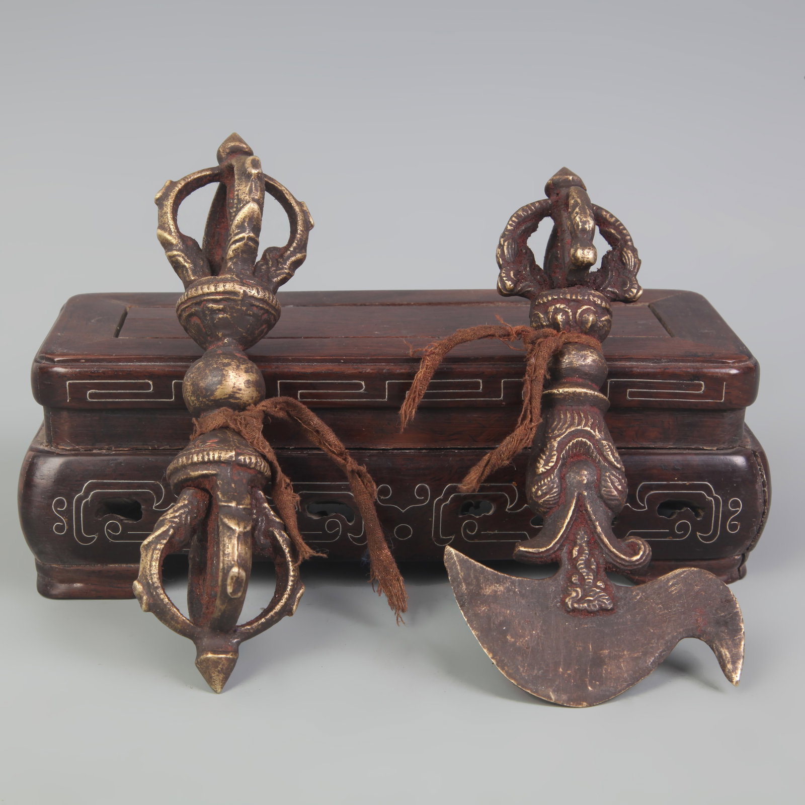 A GROUP OF TWO TIBETAN BUDDHIST RITUAL IMPLEMENTS: 20th Century; Long: 5.5 inch to 5.6 inch ; wooden base for picture and display purpose only.