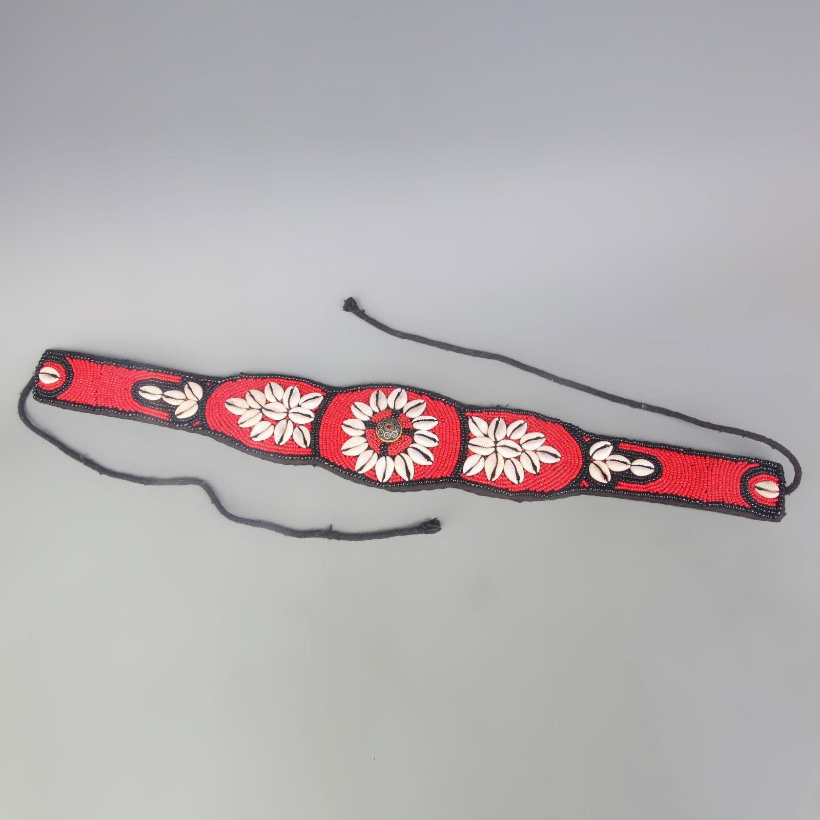 A GROUP OF TIBETAN BUDDHIST ORNAMENTS (RED CORAL AND SHELL): Modern; Long: 24.4 inch