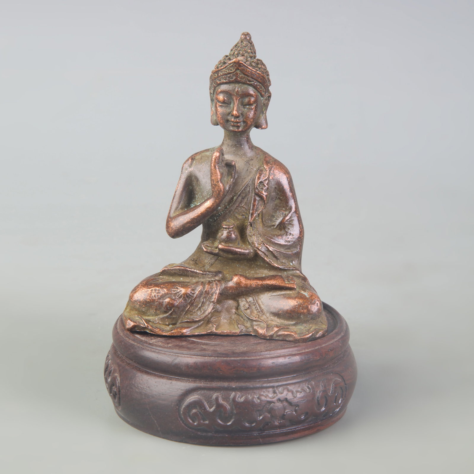 A SMALL BRONZE BUDDHA STATUE: Qing Dynasty; High:3.3 inch; wooden base for picture and display purpose only.