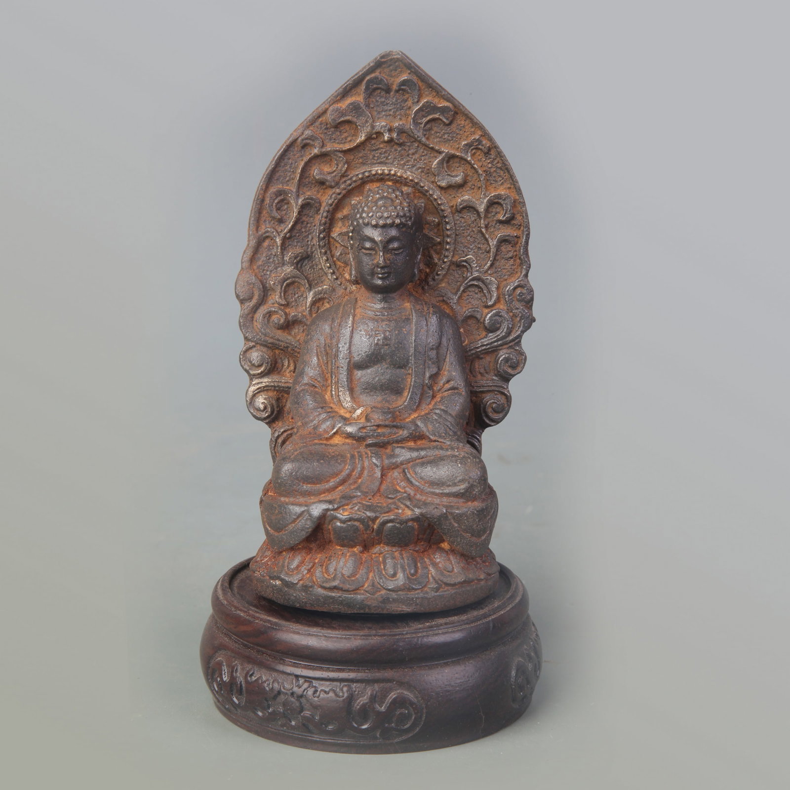 A SMALL CAST IRON SHAKYAMUNI BUDDHA: Qing Dynasty; High: 4.7 inch;; wooden base for picture and display purpose only.
