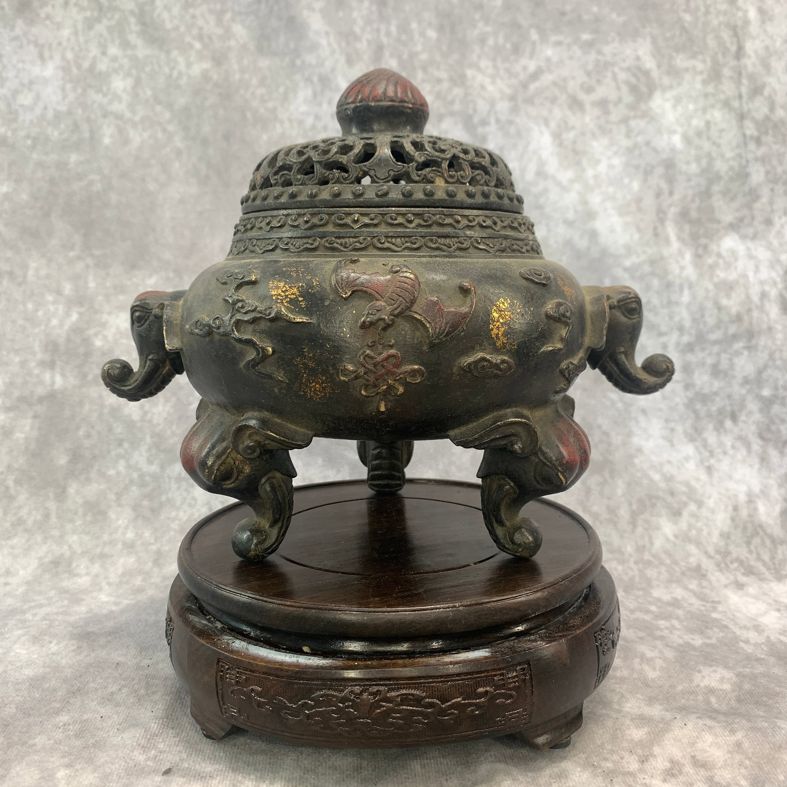 A CHINESE PARCEL-GILT AND POLYCHROME BRONZE 'ELEPHANT AND BATS' TRIPOD INCENSE BURNER AND COVER: Republic Period; Long: 8.3 inch; Width:6.1 inch; High: 6.9 inch; wooden base for picture and display purpose only.