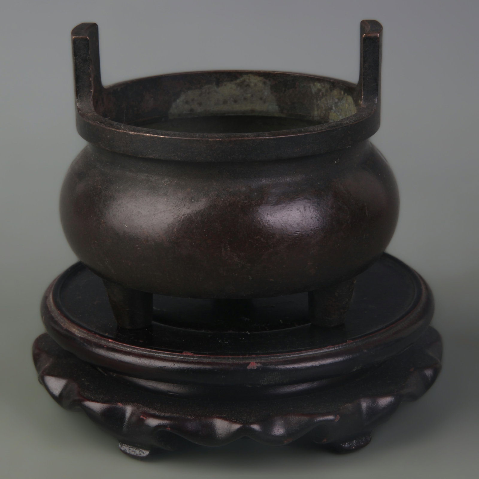 BRONZE TRIPOD INCENSE BURNER WITH STANDING EARS: Qing Dynasty Qian Long Period; Width: 3.6 inch; High: 3.4 inch; wooden base for picture and display purpose only.