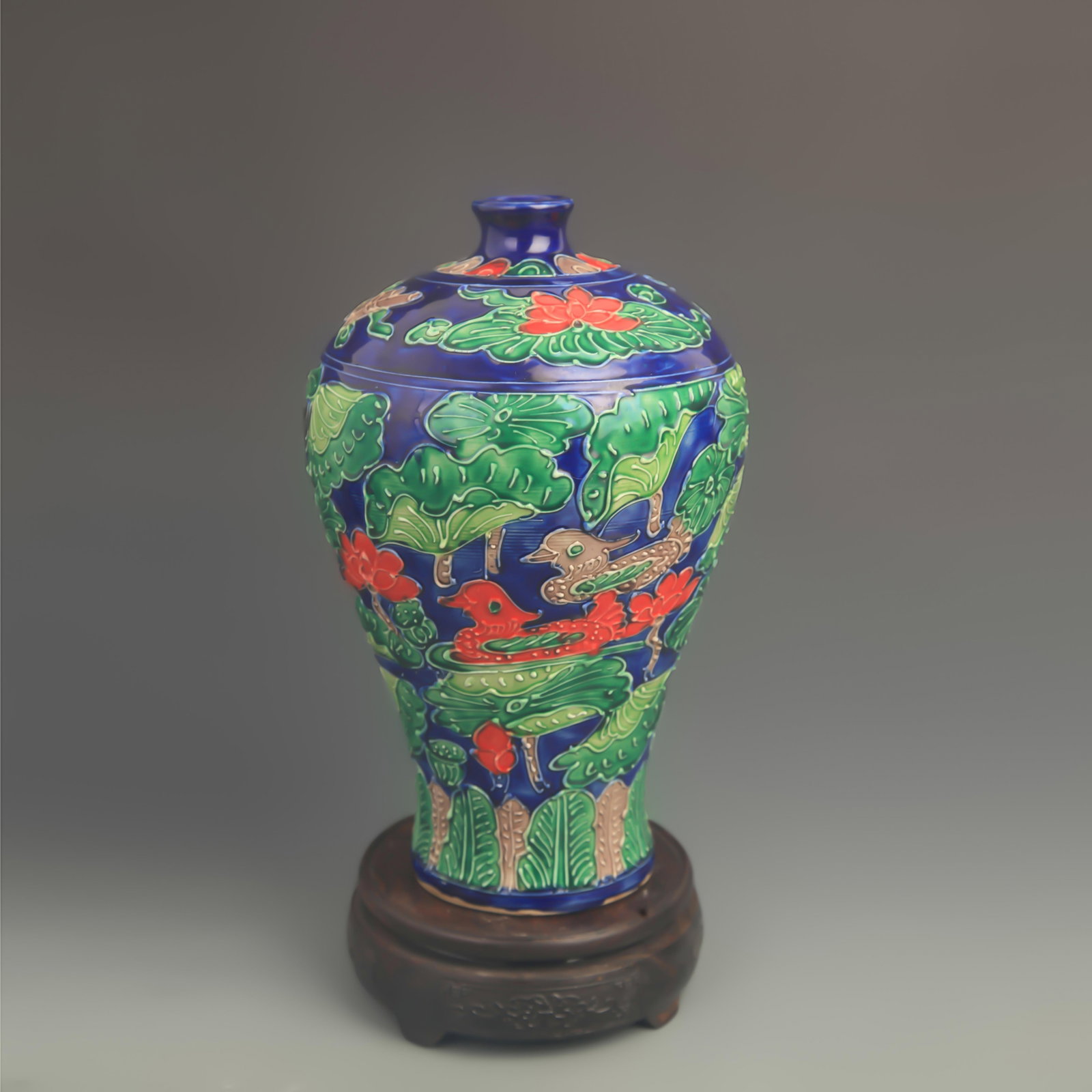 A FAHUA ENAMEL BLUE-GROUND PLUM VASE: Ming Dynasty Hong Zhi Style; High: 10.1 inch; Diameter: 6.00 inch; wooden base for picture and display purpose only.