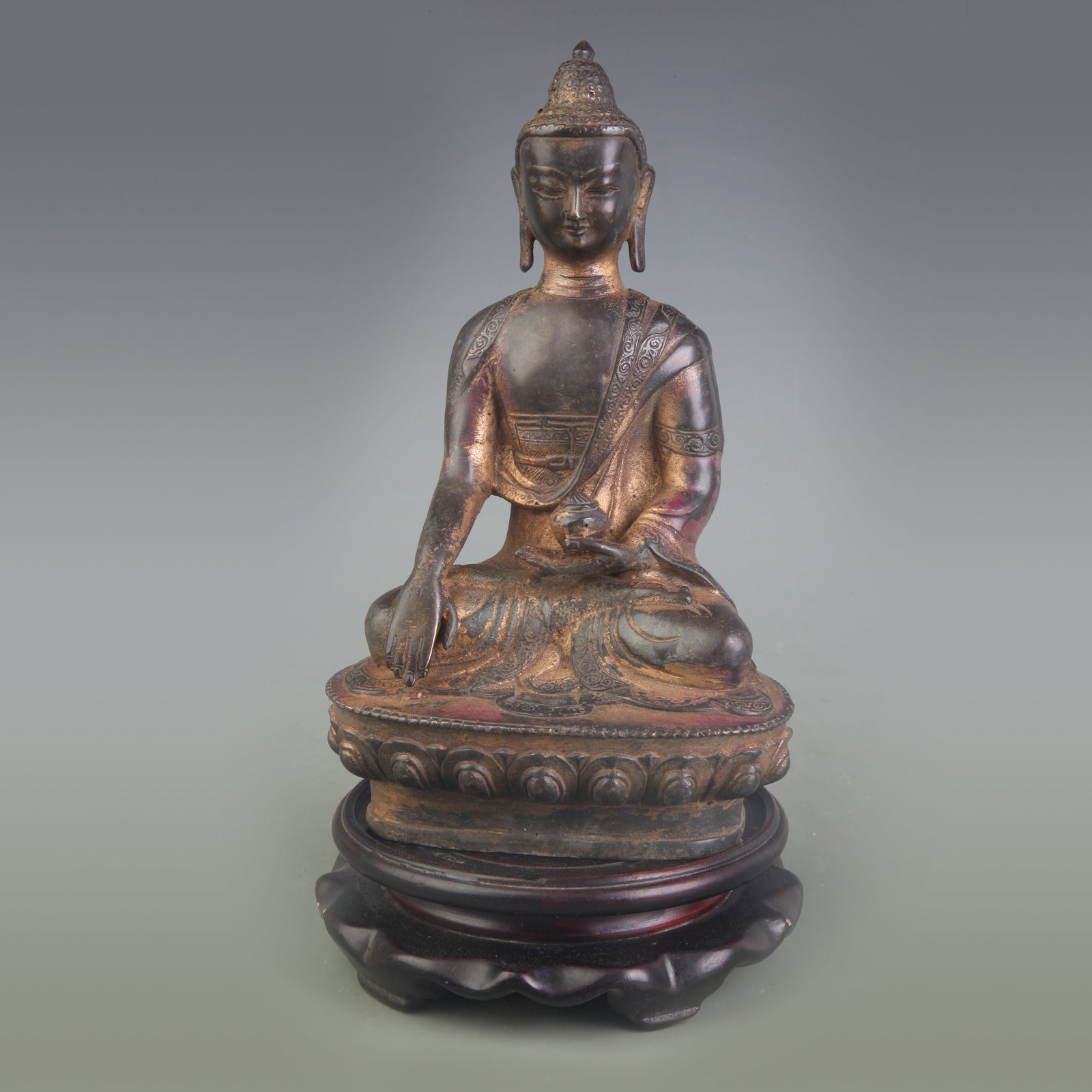 A BRONZE FIGURE OF MEDICINE BUDDHA: 18th Century; Width: 5.0 inch; High: 7.5 inch; wooden base for picture and display purpose only.