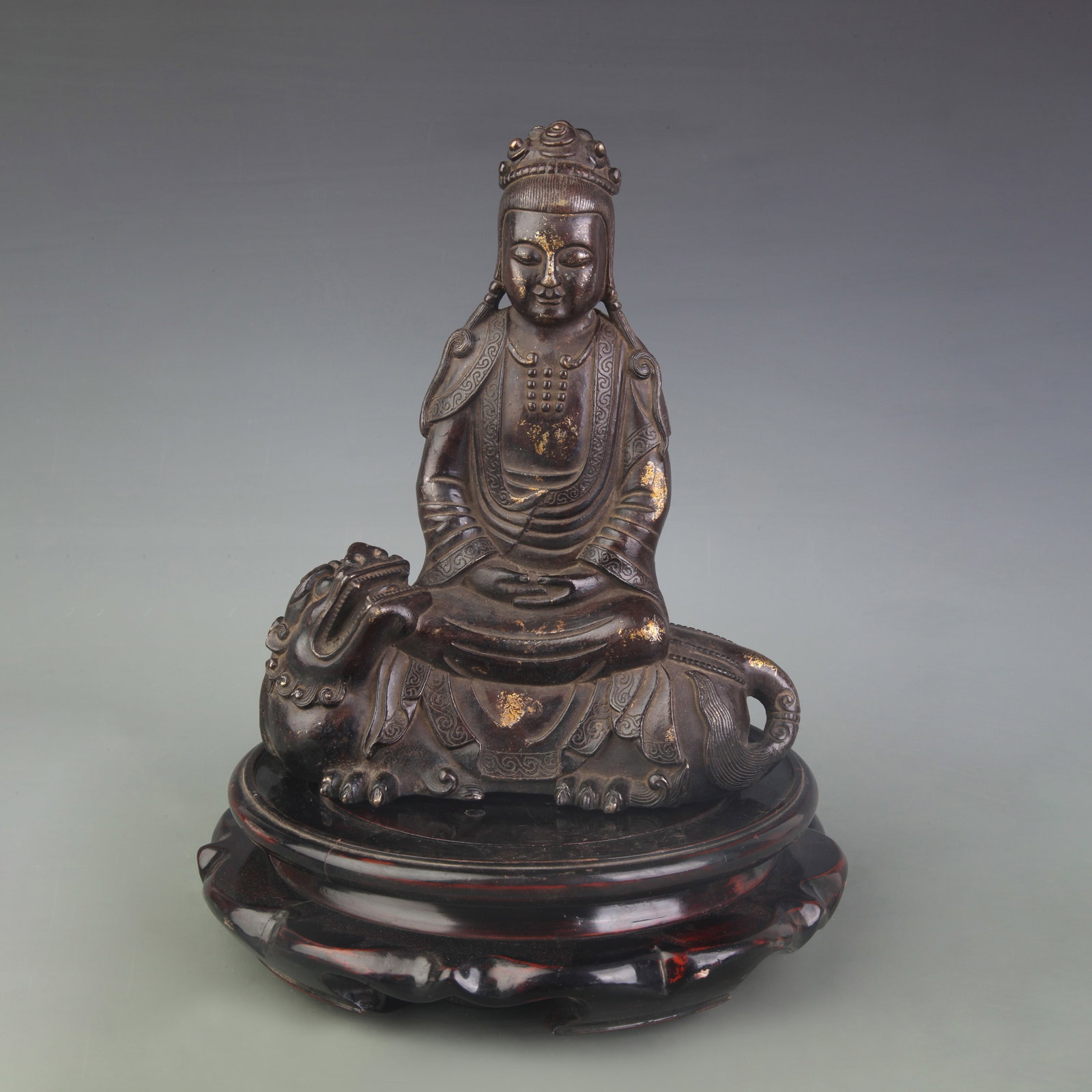 A FINE BRONZE GUAN YIN SITTING STATUE: Qing Dynasty; High: 9.7 inch; wooden base for picture and display purpose only.