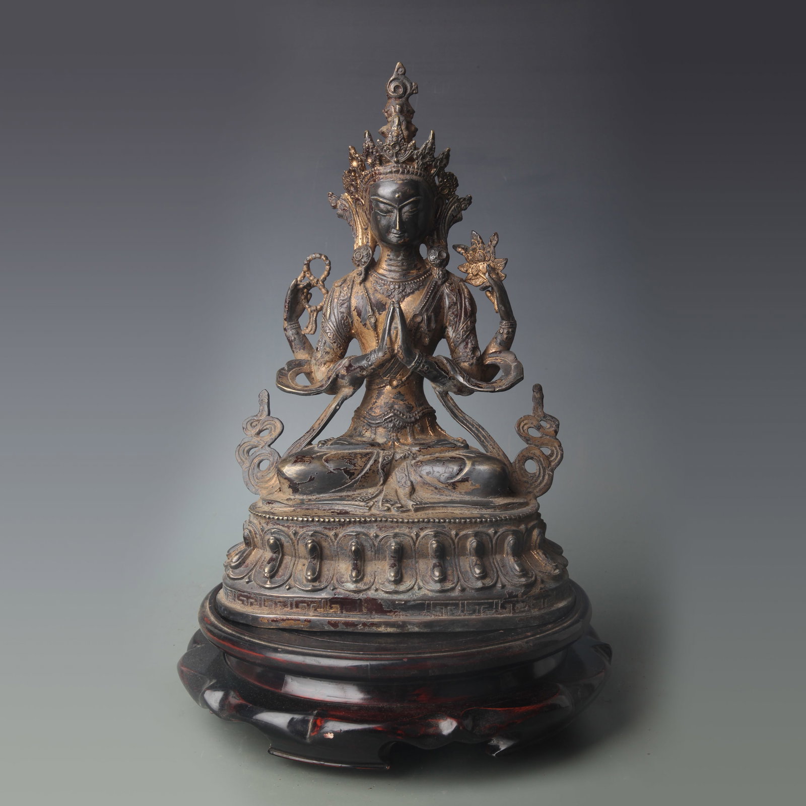 A FINE BRONZE FOUR-ARMED GUANYIN FIGURE: Qing Dynasty; High: 12.3 inch; wooden base for picture and display purpose only.