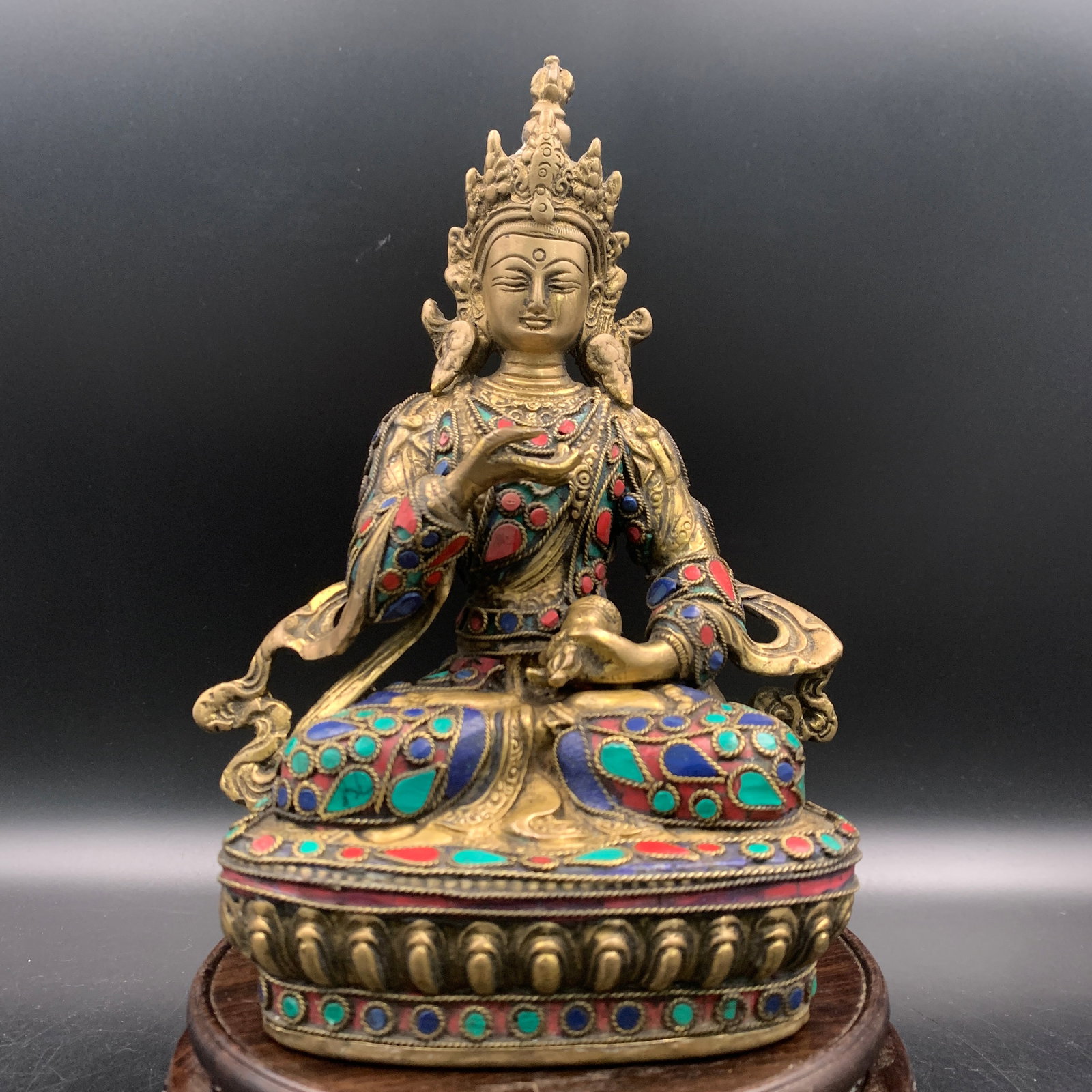RARE TIBETAN FIGURE OF A SEATED DEITY WITH TURQUOISE AND LAPIS INLAYS: Ming Dynasty Style; Long: 5.9 inch; Width: 3.3 inch; High: 8.7 inch; wooden base for picture and display purpose only.