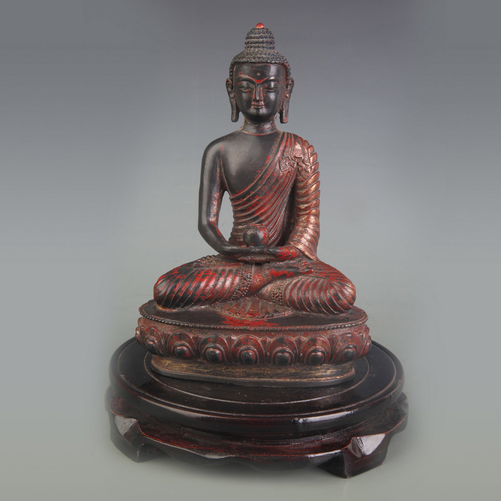 A SMALL BRONZE SEATED GUANYIN STATUE: Qing Dynasty; High: 4.8 inch ; wooden base for picture and display purpose only.