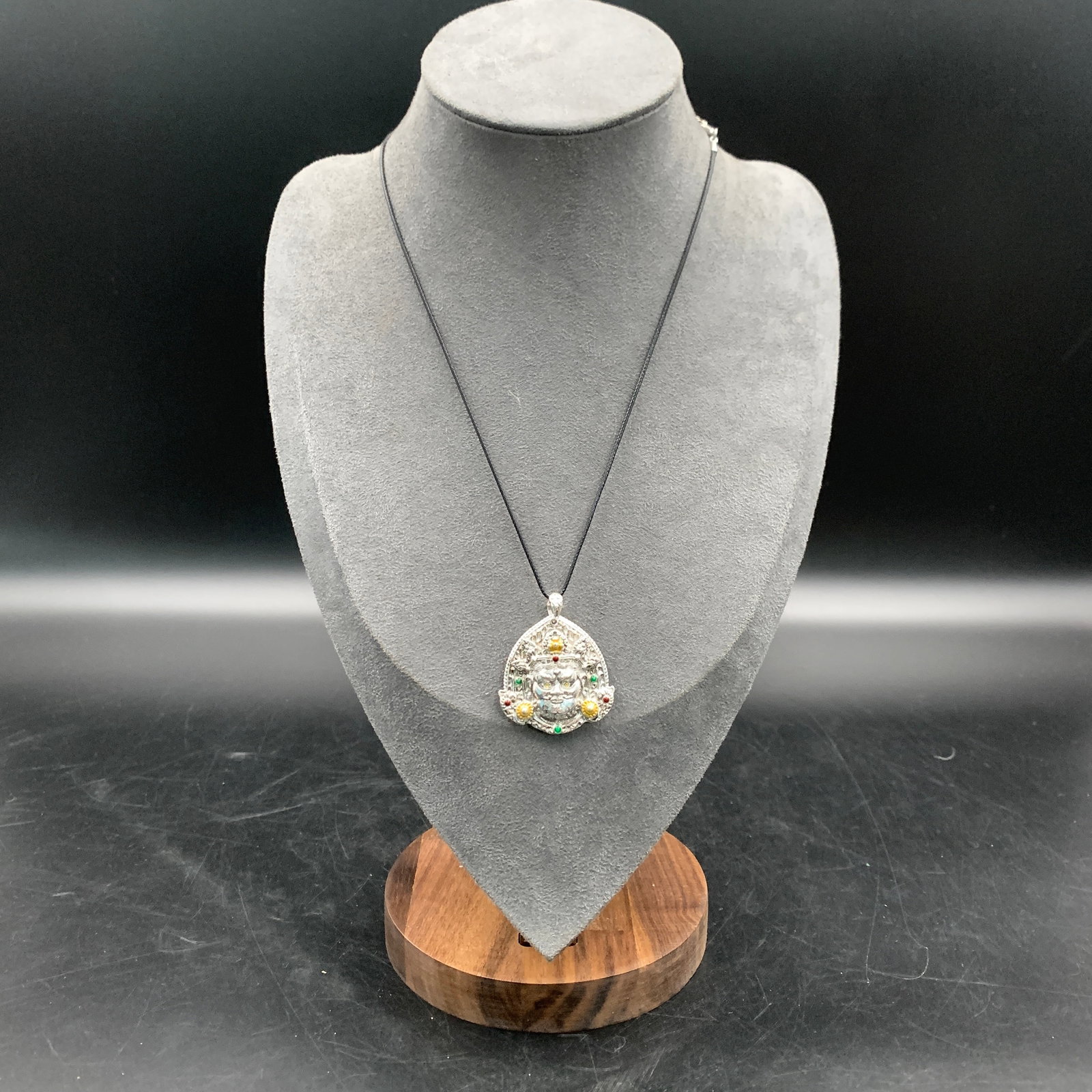 TIBETAN BUDDHIST PROTECTIVE AMULET NECKLACE: Modern; Long: 1.5 inch; Width:1.3 inch; Heigh: 0.4 inch; Wooden base for picture and display only.