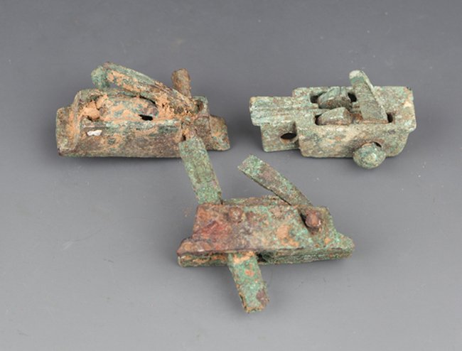 A GROUP OF THREE CROSSBOW PARTS: Han Dynasty, L:1.7 in