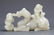 A FINELY CARVED GREENISH WHITE JADE DECORATION