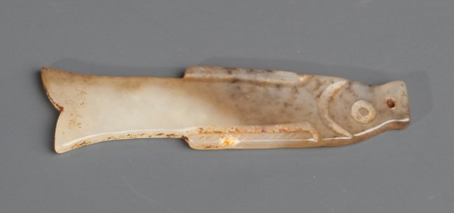 A OLD WHITE JADE PLAQUE IN FIGURE OF FISH: Shang Dynasty, L:2.0 in