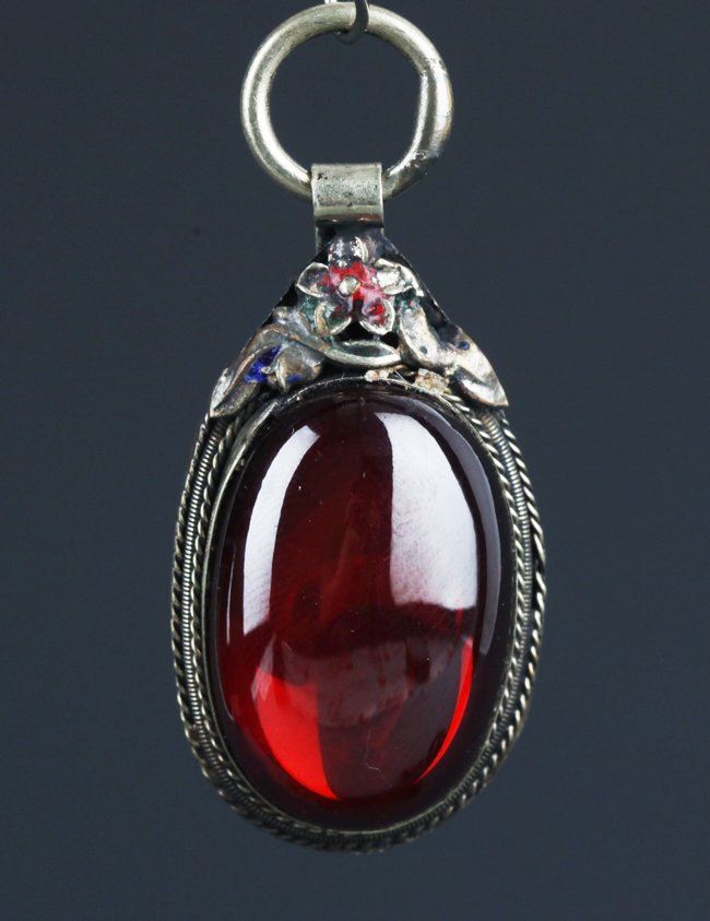 A BRONZE AND ZIRCON EMBED PENDANT: Republic Period, L:1.5 in