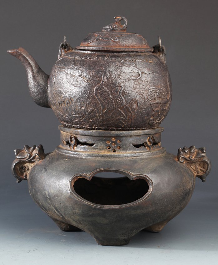 A SET OF "CRANE" CARVING IRON TEA POT: Japan 20th Century, W: 9.9 in H: 11.0 in