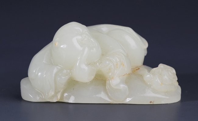 A FINELY CARVED WHITE JADE IN FIGURE OF BUDDHIST MONK: 20th Century, L:2.20 in×W:1.10 in