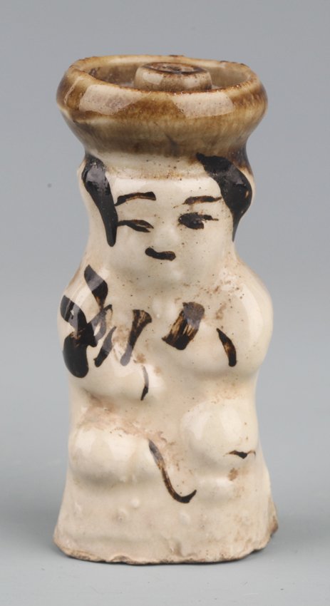 A "CI ZHOU YAO" PORCELAIN CANDLESTICKS IN FIGURE OF BOY: Ming Dynasty, H:3.1 in