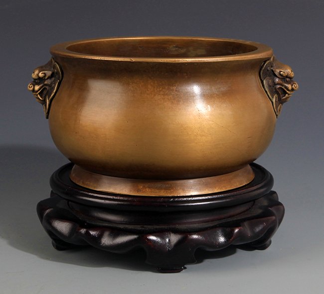 A DOUBLE LION EAR CARVING BRONZE CENSER: Ming Dynasty, D:5.0in × H:2.75in