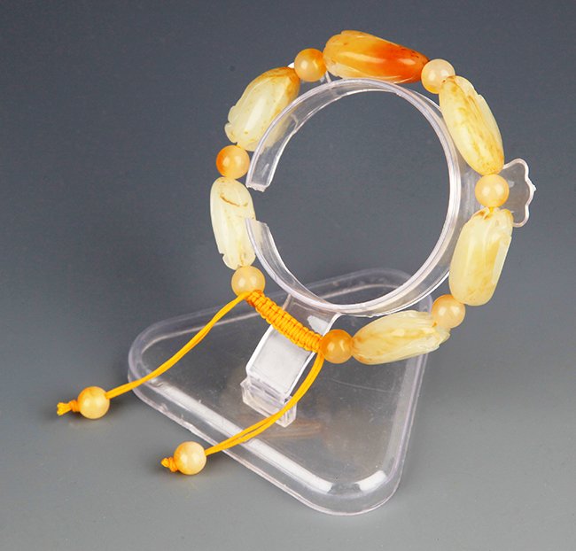 A FINE HETIAN ZILIAO JADE BRACELETS (1 of 3)