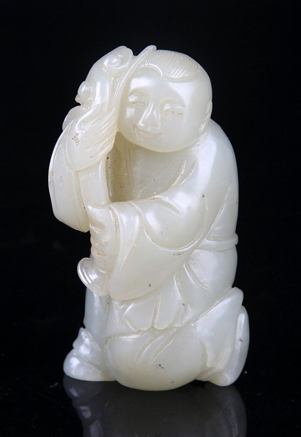 A BOY CARVING PALE CELADON JADE (1 of 5)