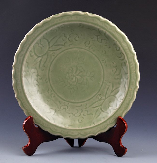 A FINELY CARVED LONG QUAN PORCELAIN PLATE: Probably Ming Dynasty, D:11.2 inch X H:2.25 inch