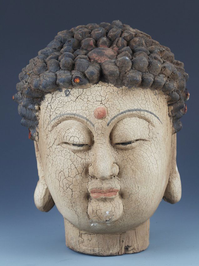 A FINELY CARVED WOODEN AKSHOBHYA BUDDHA HEAD (1 of 7)