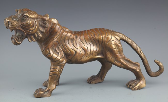 A LARGE TIGER SHAPE BRONZE DECORATION (1 of 8)