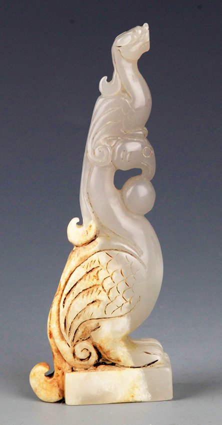 A FINELY CARVED PHOENIX SHAPED JADE (1 of 6)