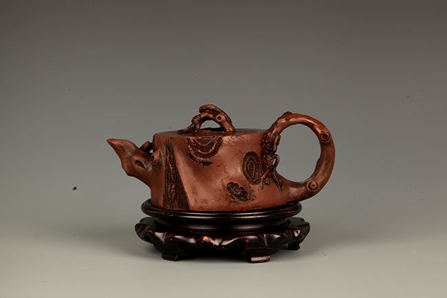 A FINELY MADE PLUM TREE TEAPOT (1 of 7)