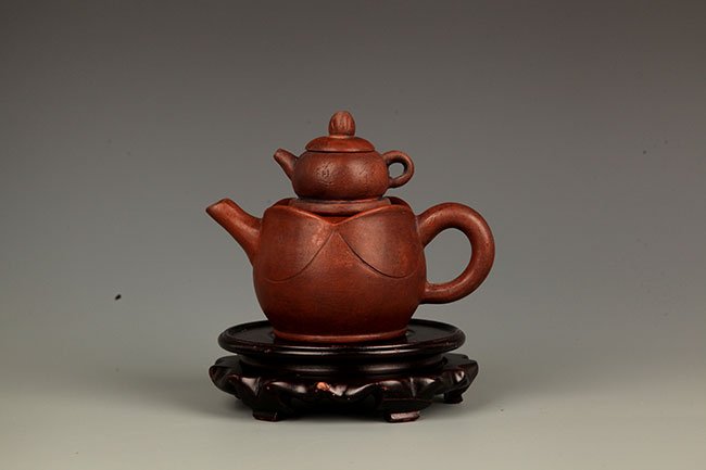 A FINELY MADE "MOTHER AND SON" TEAPOT (1 of 4)