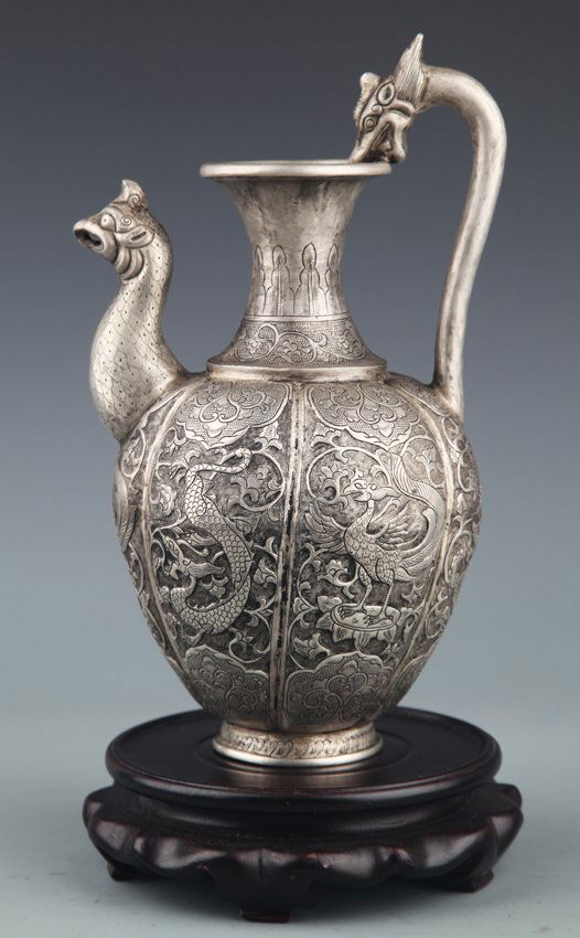 A FINELY CARVED SILVER PLATED WATER POT (1 of 7)