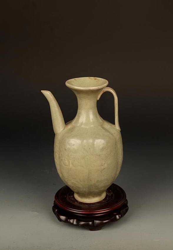 A "YAO ZHOU YAO" GREEN COLOR WATER BOTTLE: Possibly Song Dynasty, High: 7.5 inch; Width: 4.75 inch; Diameter: 2.5 inch