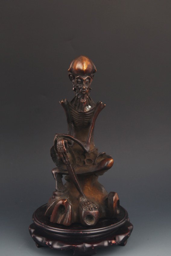 A FINE SLIM ROHAN FIGURE: Possibly Ming Dynasty, High: 8.5 inch; Width: 3.5 inch