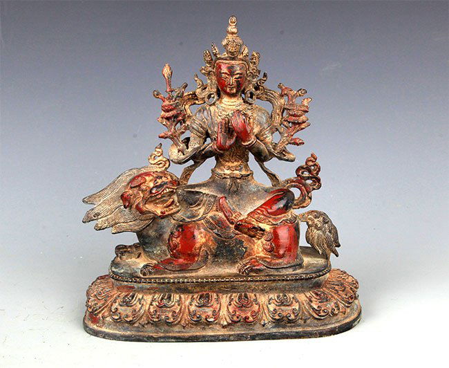 A BRONZE BUDDHA AND LION FIGURE (1 of 9)