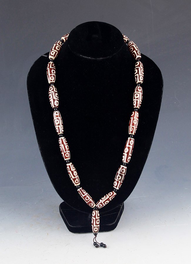 AN OLD "NINE EYES" TIAN ZHU NECKLACE, 18 PCS: AN OLD "N inchE EYES" TIAN ZHU NECKLACE, 18 Pcs; West Zhou, High:1.4 inch ; Width: 0.5 inch