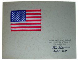 547: Davd Scott Apollo 9 Flown US Flag: A silk US flag (4 x 6) mounted on artboard (to 14 x 11"). The text on the board reads "Carried into space during the flight of Apollo IX, 3 - 13 March 1969". Signed in black Sharpie "Dave Scott Apollo