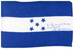 831: Flown Apollo 15 Honduras Silk Flag: (4 x 6") David Scott has written in blue ink on the flag: "This flag carried to the Moon aboard Apollo 15 Dave Scott Apollo 15 CDR. Ex. The David Scott collection. Rare.Flown in Space? YES"