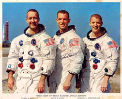Apollo 15 David Scott Autograph: on a NASA color publicity lithograph (8 x 10") of the Apollo 9 crew. Signed in black Sharpie. Modest toning and staining due to age.